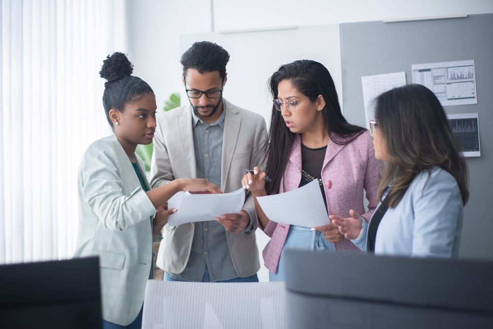 A healthcare team reviewing documents together