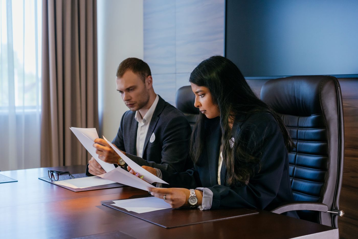 Two business owners reviewing documents